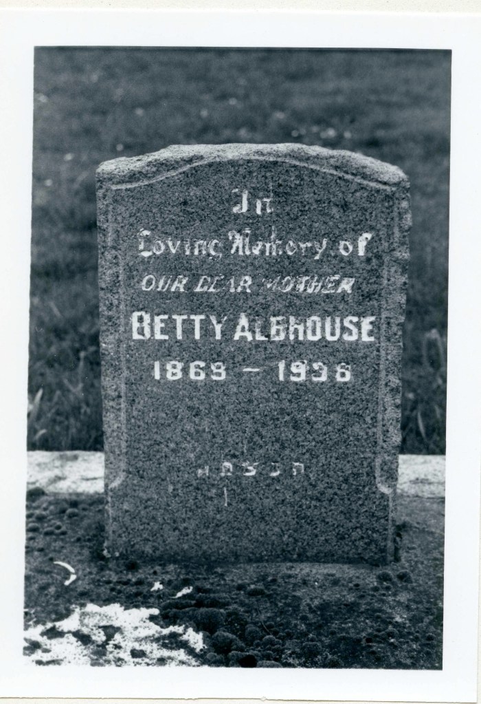 black & white photo of grave marker
