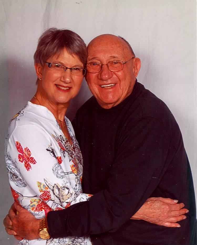 colour photo of a man and woman hugging